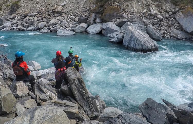 Rafting guides check out river