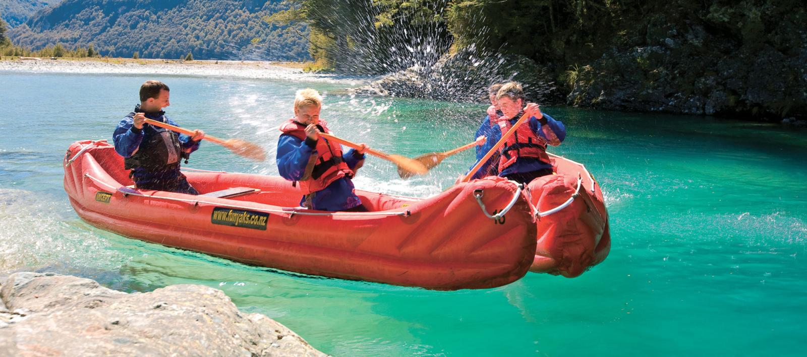 Kids kayaking down the Dart River near Queenstown.