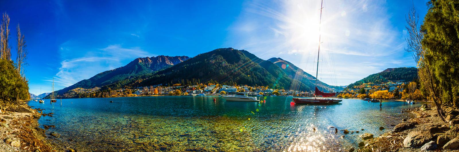 A sailing boat crossing Lake Wakatipu in the South Island